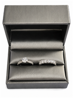 Silver leatherette double ring box with engagement ring and wedding band
