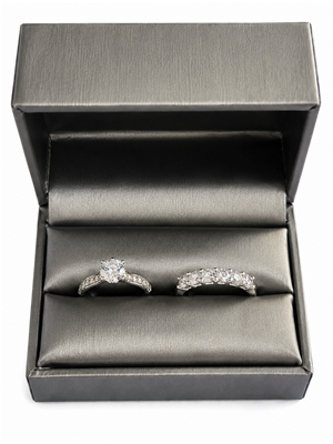 Silver leatherette double ring box with engagement ring and wedding band