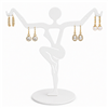 White metal earring display stand holding three pairs of earrings