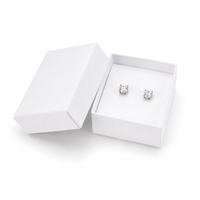 White cardboard earring jewelry box with stud earrings