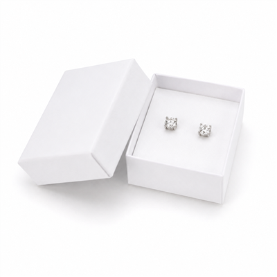 White cardboard earring jewelry box with stud earrings