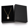 Black cardboard necklace jewelry box with gold pendant necklace