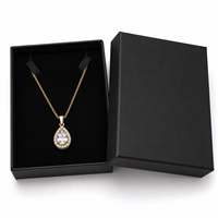 Black cardboard necklace jewelry box with gold pendant necklace