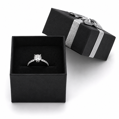 Black ring jewelry box with silver bow and ring