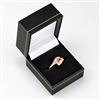 Black leatherette ring box with gold trim and velvet insert