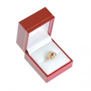 Red leatherette jewelry box with velvet insert, ideal for rings and gift presentation
